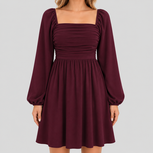 Long sleeve mini dress with square neckline, pleated bodice, defined waist, and flowy fit-and-flare silhouette