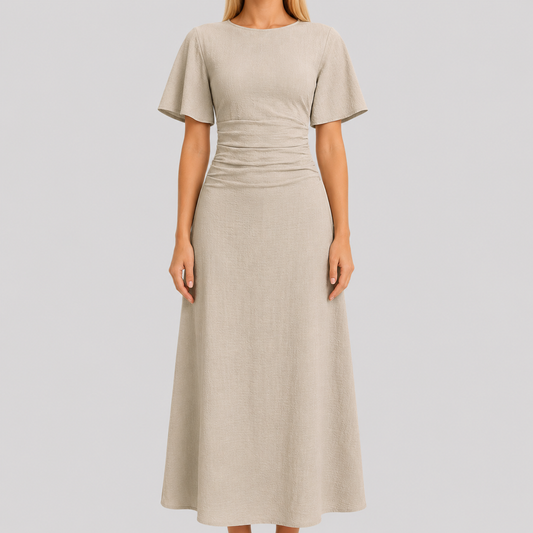 Short sleeve maxi dress with round neckline, ruched waistband, and sleek column silhouette