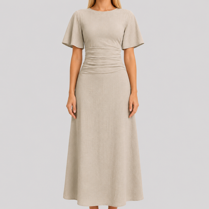 Short sleeve maxi dress with round neckline, ruched waistband, and sleek column silhouette