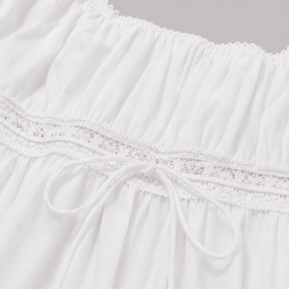 Square-neck peplum top with lace trim, short puff sleeves, adjustable drawstring waist, and flowy hem for a romantic feminine look