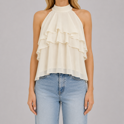 Sleeveless halter blouse with mock neckline, tiered cascading ruffles, and flowy chiffon silhouette for an elegant feminine look