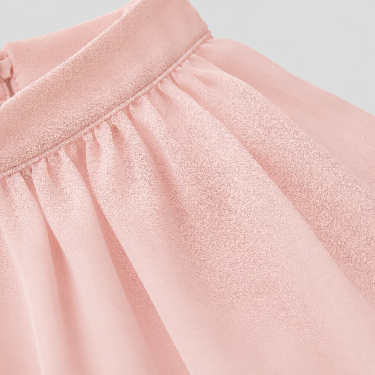 Sleeveless tiered mini dress with halter neckline and cascading chiffon ruffles
