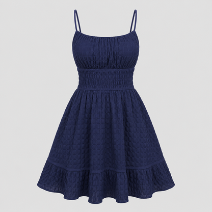 Sleeveless mini sundress with square neckline, smocked waistband, textured fabric, and flared ruffle hem