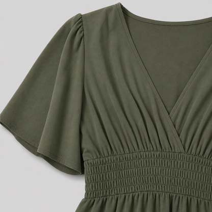 Flutter sleeve maxi dress with surplice V-neckline, smocked waistband, and flowing floor-length silhouette